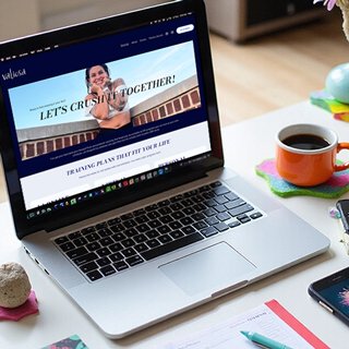 Fitness trainer website design on laptop showing 'Let's Crush Together' wellness program landing page - JADY Design Squarespace website for health and fitness expert selling online programs